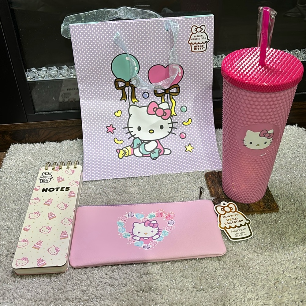 Hello Kitty tumbler, notebook, pencil pouch, and gift bag gift set.